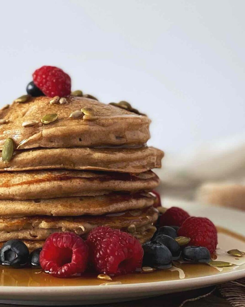oat pancakes topped with berries